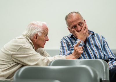 Ron Underwood talking with CHSSA President and fellow Hall of Famer Reed Niemi during the 2019 California High School Speech Association State Championship.